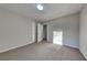 Simple bedroom with neutral walls, carpet, and doors to other rooms at 2395 River Run Dr, Douglasville, GA 30135