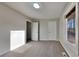 Bright bedroom with neutral walls, carpet, and ample closet space at 2395 River Run Dr, Douglasville, GA 30135