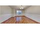 Formal dining room with hardwood floors and large window at 2395 River Run Dr, Douglasville, GA 30135