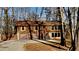 Two-story house with attached two-car garage and wooded backdrop at 2395 River Run Dr, Douglasville, GA 30135