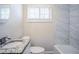 Bathroom with vanity, granite countertop, toilet, and tiled shower/bath, creating a clean, modern aesthetic at 3418 Longleaf Dr, Decatur, GA 30032