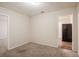 Bedroom with neutral carpet and access to the kitchen at 3418 Longleaf Dr, Decatur, GA 30032