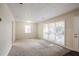 Bright living room with neutral carpet and lots of natural light at 3418 Longleaf Dr, Decatur, GA 30032