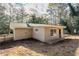 Tan, single-story home with neutral trim, gray roof, and small, rectangular windows at 3418 Longleaf Dr, Decatur, GA 30032