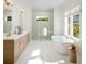 Luxurious bathroom with soaking tub and double vanity at 225 Mayfair Ct, Alpharetta, GA 30009