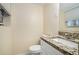 Small bathroom with granite countertop and white vanity at 2876 Battle Forrest Dr, Decatur, GA 30034