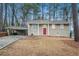 Ranch style home with carport and red front door at 2876 Battle Forrest Dr, Decatur, GA 30034