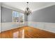 Bright dining room, hardwood floors and wainscoting at 6202 Millstone Trl, Douglasville, GA 30135