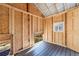 Unfinished interior of a treehouse, featuring wood framing and flooring at 7434 Woodruff Way, Stone Mountain, GA 30087