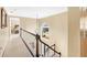 Upstairs hallway with carpeting and window overlooking backyard at 7434 Woodruff Way, Stone Mountain, GA 30087