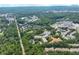 An aerial view of a lush residential community near a pond and surrounded by mature trees at 1800 Clairmont Lk # 413, Decatur, GA 30033