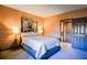 Bedroom featuring a queen bed, abstract art and decor, and closet at 1800 Clairmont Lk # 413, Decatur, GA 30033