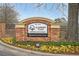 Entrance to Clairmont Place, a senior living community with well-maintained landscaping and a brick sign at 1800 Clairmont Lk # 413, Decatur, GA 30033