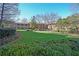 Brick building with a wide green space featuring manicured lawn and bushes in a peaceful setting at 1800 Clairmont Lk # 413, Decatur, GA 30033