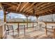 Interior of a gazebo on a lake, featuring wooden chairs, wooden deck, and views of the lake at 1800 Clairmont Lk # 413, Decatur, GA 30033