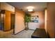 Hallway provides access to a kitchen and living room, plus a decorative potted plant on display at 1800 Clairmont Lk # 413, Decatur, GA 30033