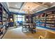 Well-appointed library with floor-to-ceiling bookshelves and comfortable seating around a table at 1800 Clairmont Lk # 413, Decatur, GA 30033