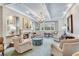 Bright living room with fireplace, chandelier, and lots of comfortable seating at 1800 Clairmont Lk # 413, Decatur, GA 30033
