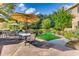 Outdoor patio with tables, chairs, and umbrellas for relaxing in a landscaped setting next to the building at 1800 Clairmont Lk # 413, Decatur, GA 30033