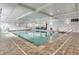 Indoor pool featuring tiled flooring, recessed lighting, and large windows at 1800 Clairmont Lk # 413, Decatur, GA 30033