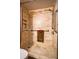 This walk-in shower features natural tile and integrated handrails at 1800 Clairmont Lk # 413, Decatur, GA 30033