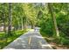 Scenic walking path lined with lush greenery offers a peaceful and inviting space for outdoor recreation and exercise at 1800 Clairmont Lk # 413, Decatur, GA 30033