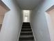 Modern staircase leading to the upper level of the home at 3541 Weathered Wood Dr, Ellenwood, GA 30294