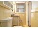 Compact bathroom featuring yellow tiles, a vanity, and a mirror at 2791 Ponderosa Cir, Decatur, GA 30033