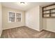 Bedroom with built-in shelving and neutral carpet at 2791 Ponderosa Cir, Decatur, GA 30033