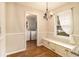 Breakfast nook with bench seating, chandelier, and view to laundry room at 2791 Ponderosa Cir, Decatur, GA 30033