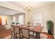 Traditional dining room with decorative chandelier, rug, and doorway leading to living room at 2791 Ponderosa Cir, Decatur, GA 30033