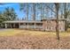 Brick ranch house with a covered porch and a spacious lawn at 2791 Ponderosa Cir, Decatur, GA 30033
