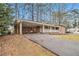 Brick ranch home with carport and a well-maintained lawn at 2791 Ponderosa Cir, Decatur, GA 30033