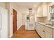 Updated kitchen featuring hardwood floors and white cabinets at 2791 Ponderosa Cir, Decatur, GA 30033