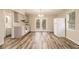 Bright kitchen featuring stainless steel appliances, laminate floors, and a view of the backyard at 2791 Ponderosa Cir, Decatur, GA 30033