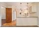 Bright kitchen with granite countertops, white cabinets, stainless steel appliances, and hardwood floors at 2791 Ponderosa Cir, Decatur, GA 30033