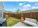 Small backyard with patio, wooden fence, and small lawn at 413 Delancy Dr, Woodstock, GA 30189