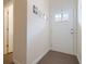 Bright entryway with hardwood floors and interior door at 413 Delancy Dr, Woodstock, GA 30189