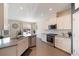 Modern kitchen with white cabinets, stainless steel appliances, and a large island at 413 Delancy Dr, Woodstock, GA 30189