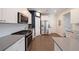 Modern kitchen with white cabinets, stainless steel appliances, and gray countertops at 413 Delancy Dr, Woodstock, GA 30189