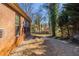 Brick home with a view of a wooded backyard at 551 Garden View Ct, Lawrenceville, GA 30046