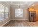 Dining area with hardwood floors and view of kitchen at 551 Garden View Ct, Lawrenceville, GA 30046