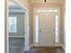 Bright entryway with hardwood floors and a view into the living room at 551 Garden View Ct, Lawrenceville, GA 30046