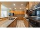 Spacious kitchen with granite countertops and modern appliances at 551 Garden View Ct, Lawrenceville, GA 30046