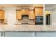 Kitchen features granite countertops and wood cabinets at 551 Garden View Ct, Lawrenceville, GA 30046