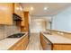 Kitchen with granite countertops, wood cabinets, and stainless steel appliances at 551 Garden View Ct, Lawrenceville, GA 30046