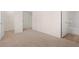 Spacious bedroom with carpet, access to bathroom and hallway at 1029 Blue Juniper Cir, Loganville, GA 30052