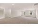 Spacious bonus room with neutral carpeting and large windows at 1029 Blue Juniper Cir, Loganville, GA 30052