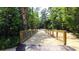 Wooden footbridge in a wooded community at 1029 Blue Juniper Cir, Loganville, GA 30052