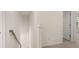 Upstairs hallway with carpeted flooring and access to bedrooms at 1029 Blue Juniper Cir, Loganville, GA 30052